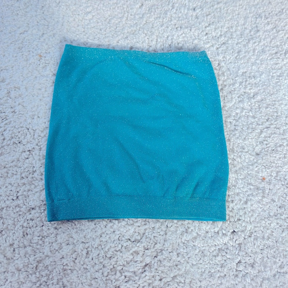 Out from under blue sparkly top